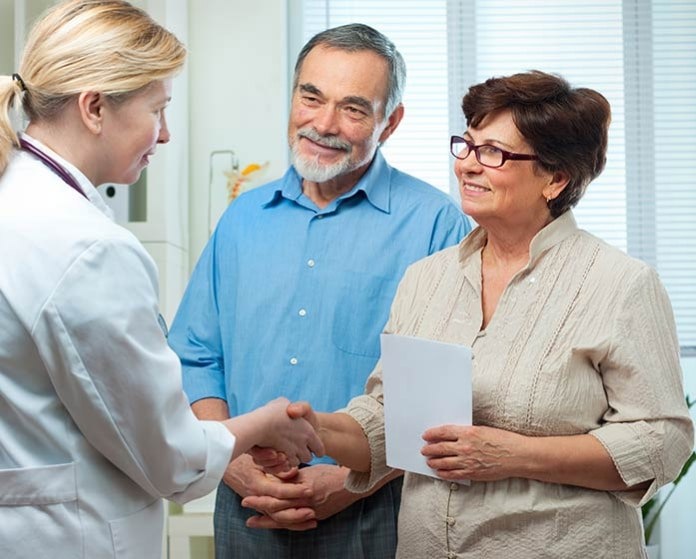 Older couple talking to a Doctor