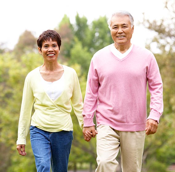 Older couple walking in the park